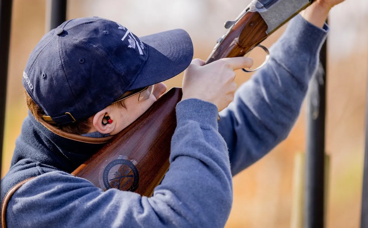 A member mounting a shotgun