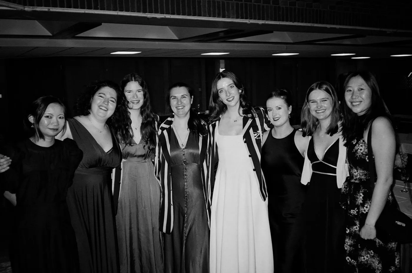 Members in evening dress and club blazers at a club dinner