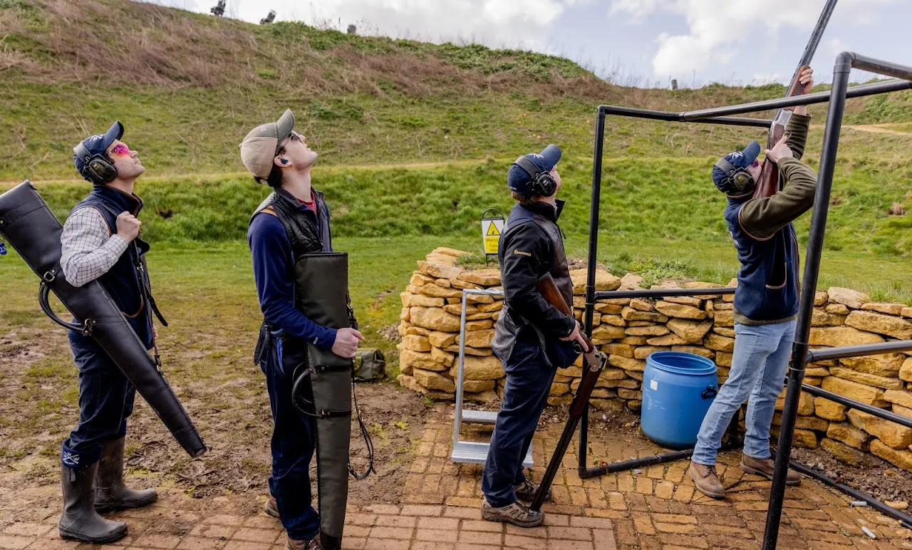 Beginners shooting with an instructor at the stand